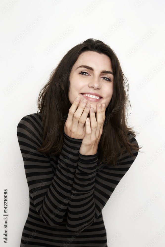 Beautiful brunette in striped top, portrait Beautiful brunette in striped top, portrait