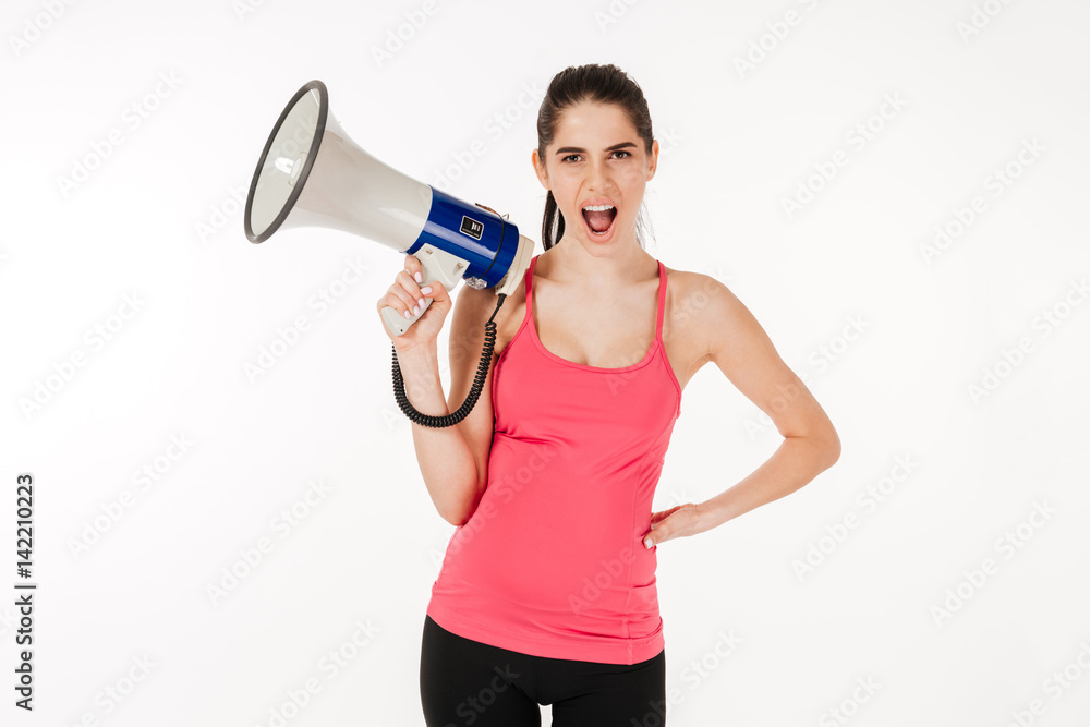 Young pregnant woman shouting in megaphone