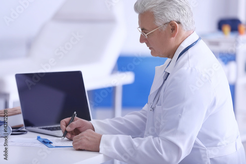 Male doctor at work in clinic