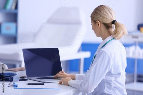 Female doctor at work in cl...
