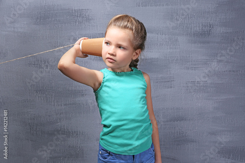 Cute little girl using plas...