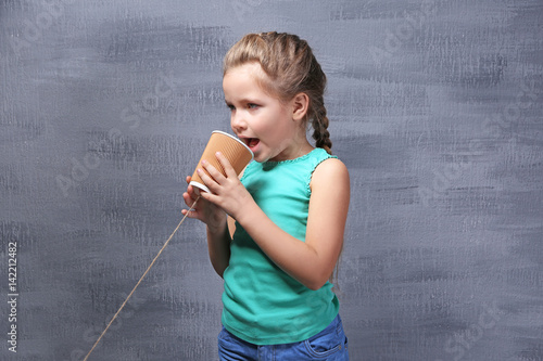 Cute little girl using plas...