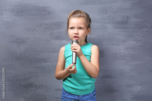 Cute little girl with micro...