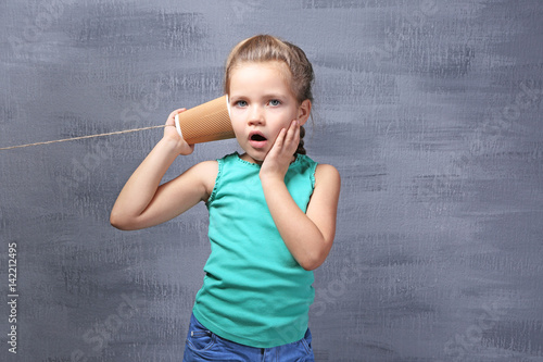 Cute little girl using plas...