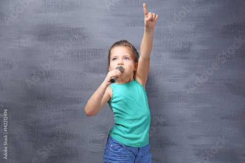 Cute little girl with micro...