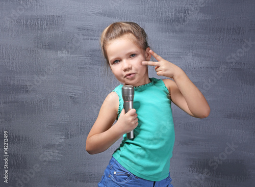 Cute little girl with micro...