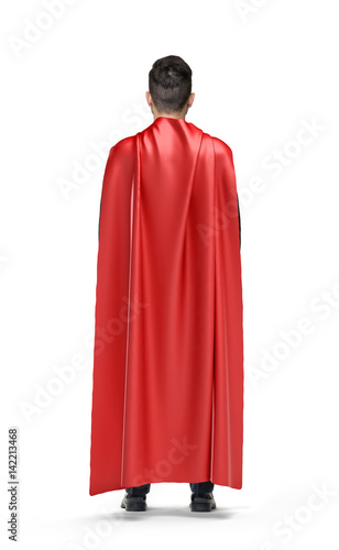 Foto A businessman in shimmering scarlet cape turned back on white background