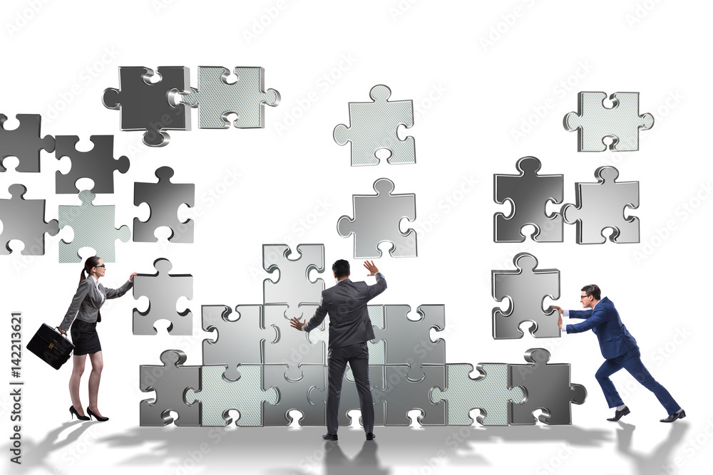 Business concept of teamwork with puzzle pieces Business concept of teamwork with puzzle pieces