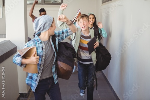 Slika na platnu Group of classmate running in corridor