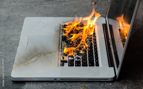 Laptop keyboard on fire and melting