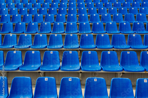 Dark blue rows of seats on the stadium