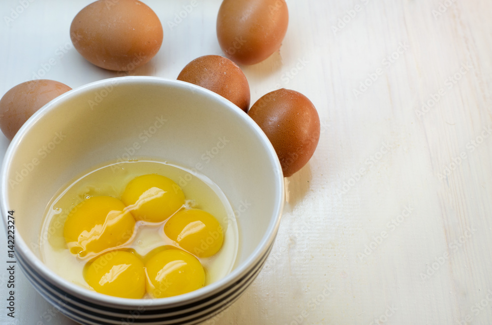 Raw eggs on a white background