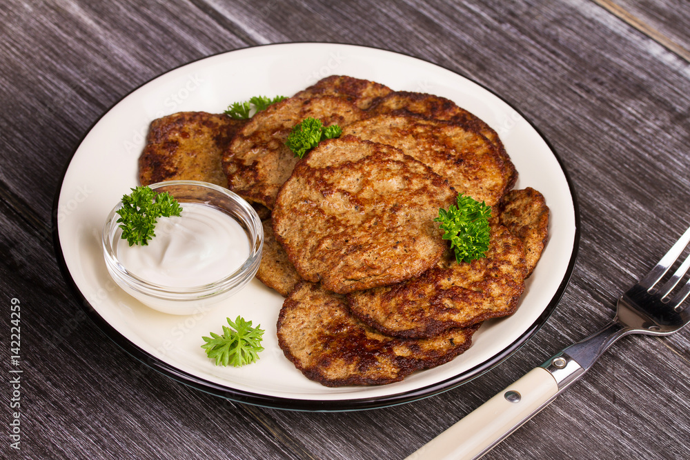 Liver Patties with Sour Cream and Parsley. Liver Cakes or Fritters of Liver. Healthy snack or take-away lunch bites.