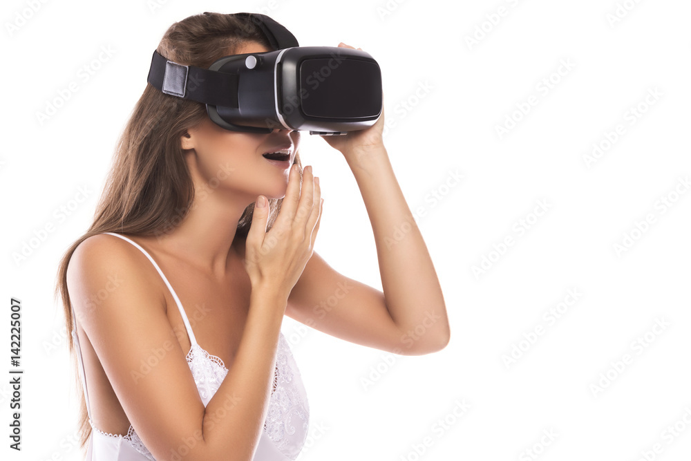Woman is using VR headset Woman is using VR headset
