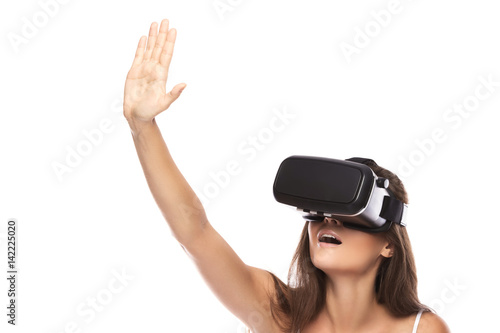 Woman is using VR headset © blackday