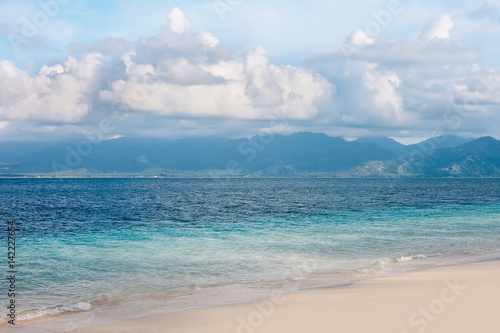 Beautiful tropical sea and beach with mountains