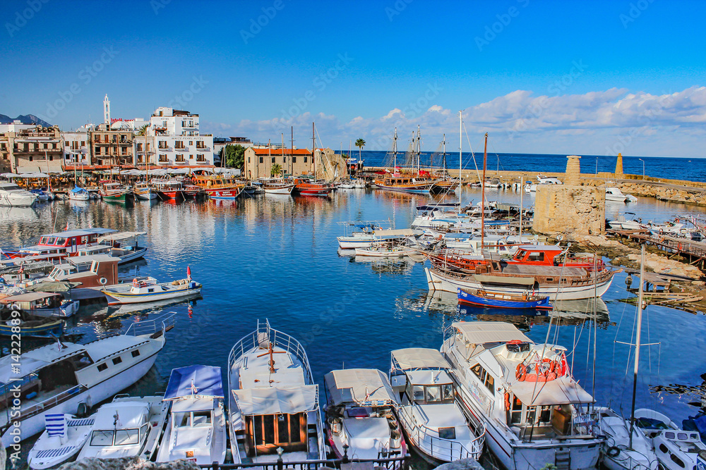 8 December 2013, Cyprus, view from Kyrenia harbor (Boats and its reflections on the historical harbor)