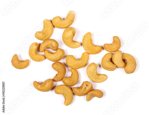 Unshelled roasted cashew nuts isolated on white background, top view


