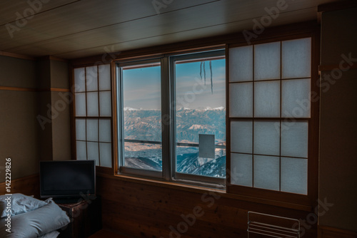 Window with Japanese alps in background