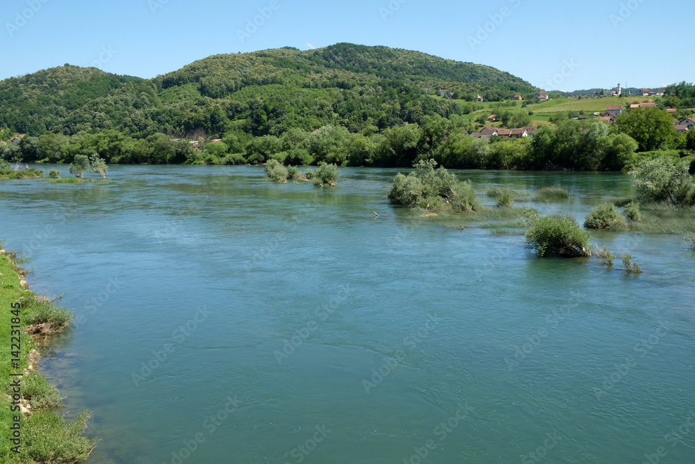River Una on a summer day in Hrvatska Kostajnica, Croatia River Una on a summer day in Hrvatska Kostajnica, Croatia