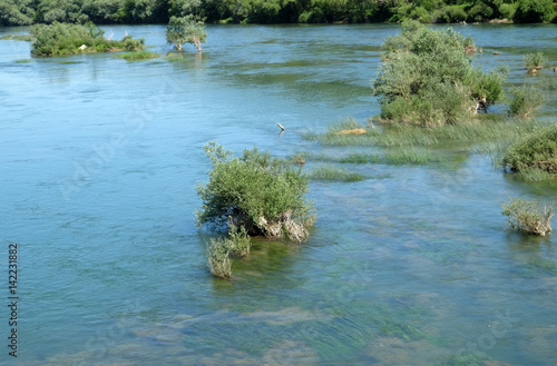 River Una on a summer day in Hrvatska Kostajnica, Croatia. photo