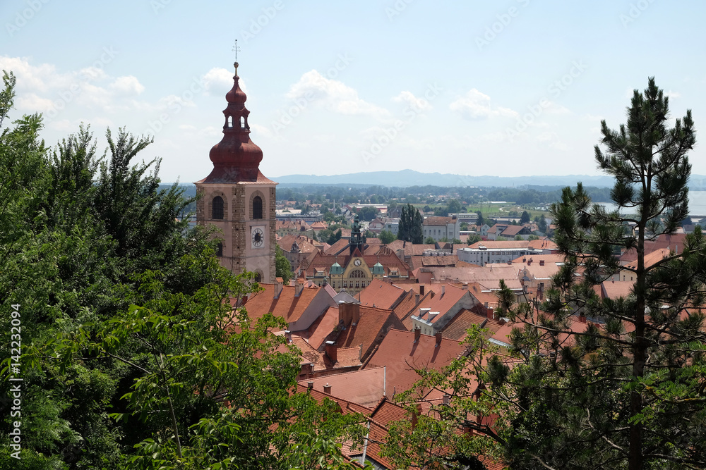 Roofs of old city center and Saint George church in Ptuj, town on the Drava River banks, Lower Styria Region, Slovenia 