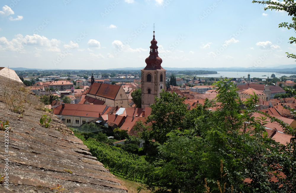Roofs of old city center and Saint George church in Ptuj, town on the Drava River banks, Lower Styria Region, Slovenia