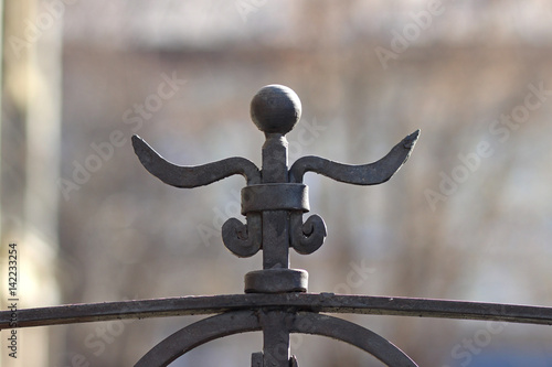 Forged decoration on the fence
