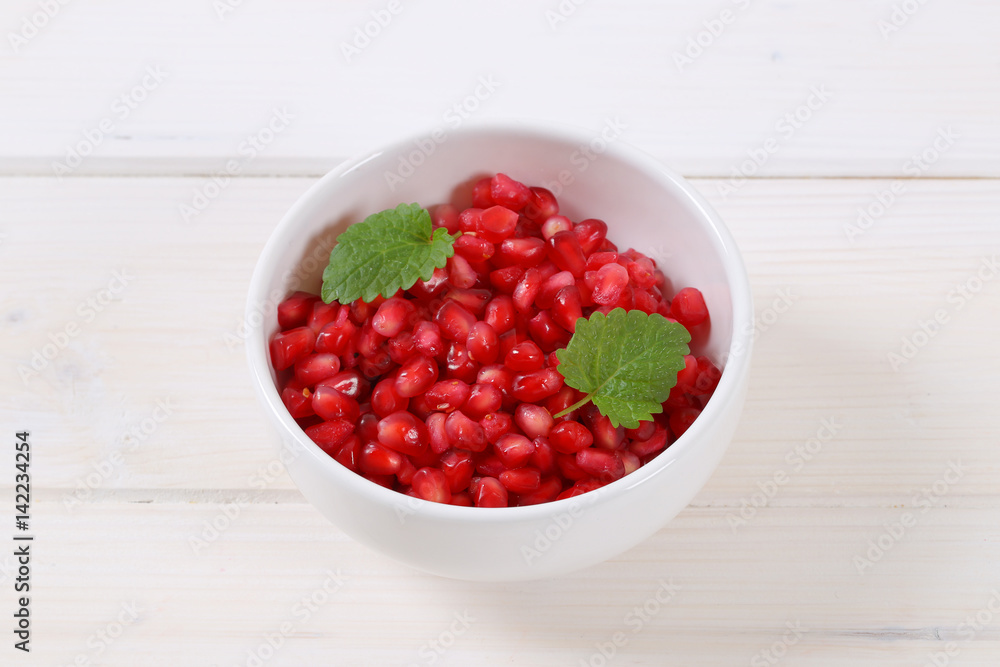 bowl of pomegranate seeds bowl of pomegranate seeds