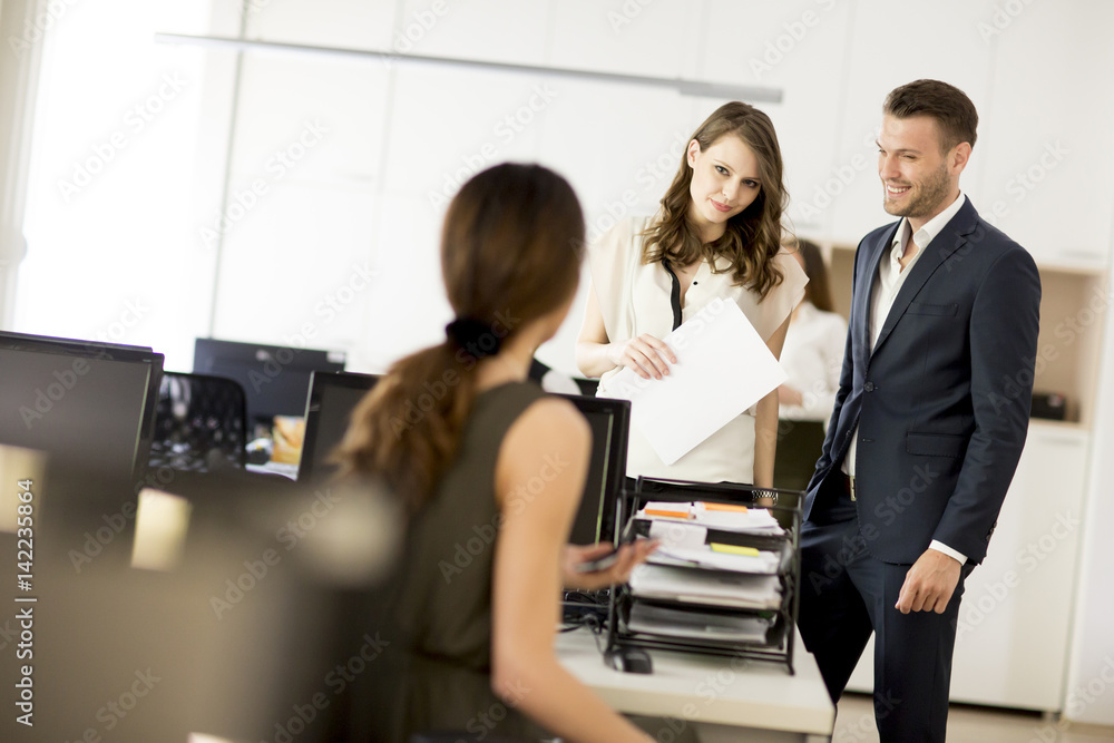 Young businesspeople working in modern office Young businesspeople working in modern office