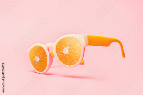 Beach sunglasses summer concept on pink background