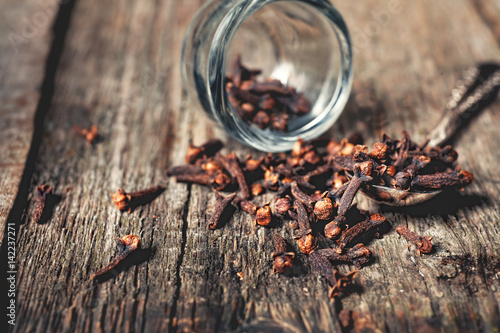 Cloves, old wooden background