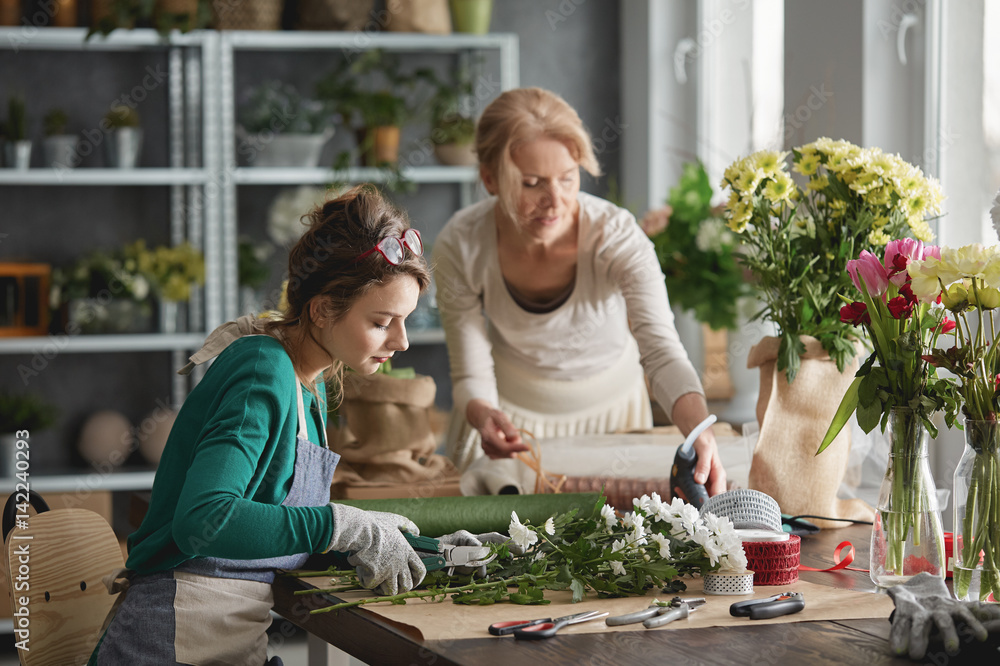 Florists making flowers bouquets Florists making flowers bouquets