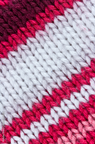 Knitted colourful fabric with diagonal stripes. Can be used as background.