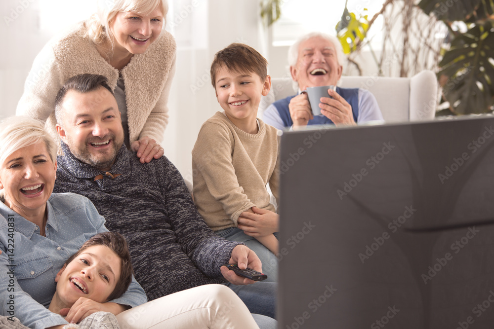 Multigenerational family watching television Multigenerational family watching television