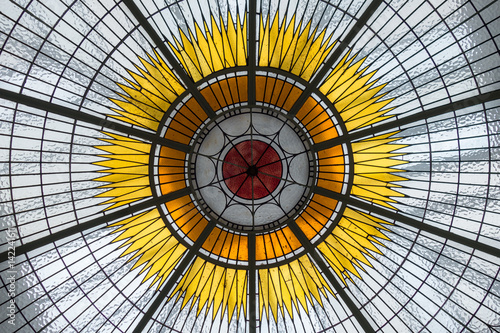 Stained glass ceiling with hub and spoke pattern photo