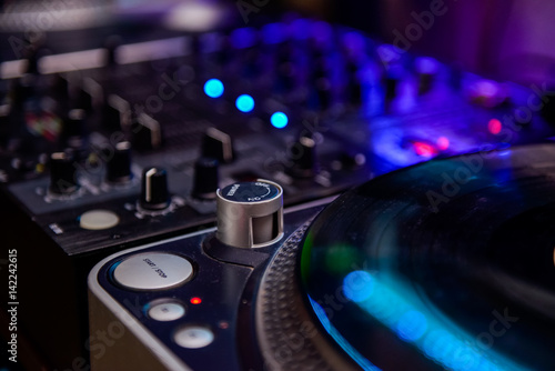 Close up Professional DJ audio equipment - turntable vinyl record player, selective focus.Sound technology for disc jockey to play at concert,party,event