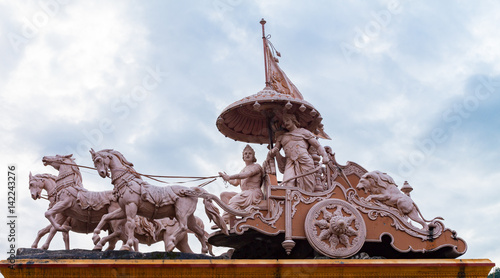 Sculpture of Hindu God Krishna and Arjuna photo