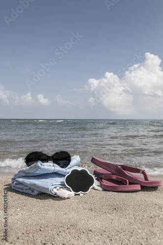 Summer background with flipflops and sunglasses