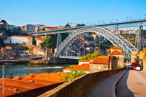 Tiled roofs in Porto. The Douro River. Summer city landscape.