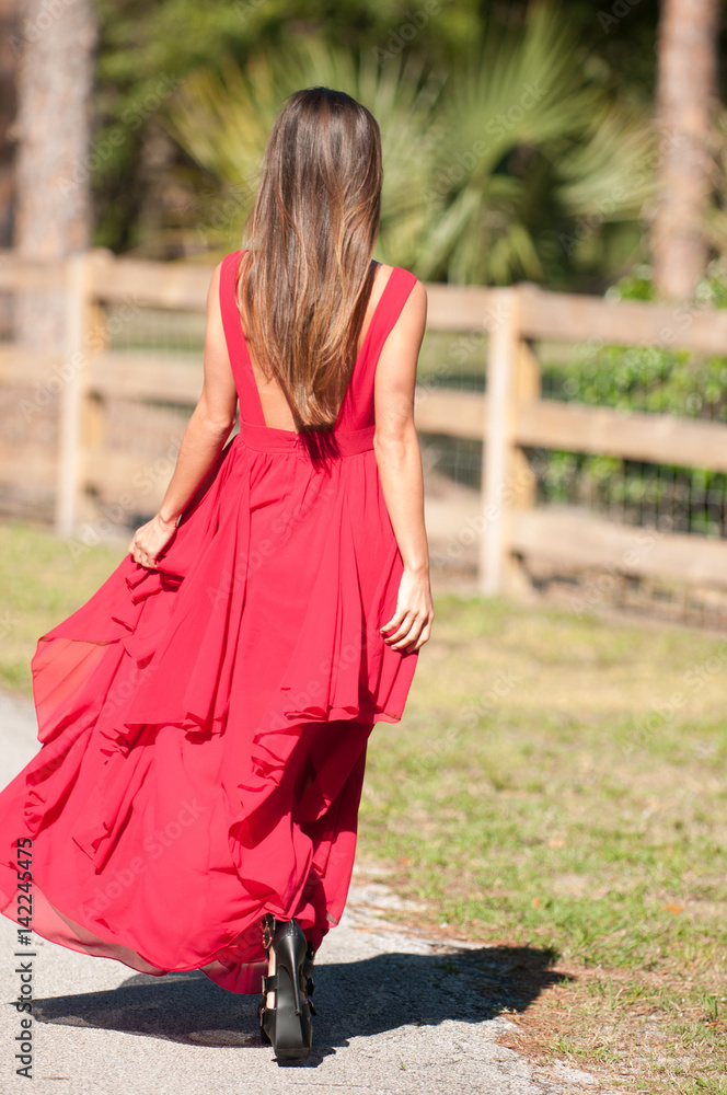 Woman in a red dress outside