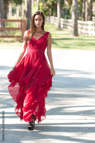 Woman in a red dress outside