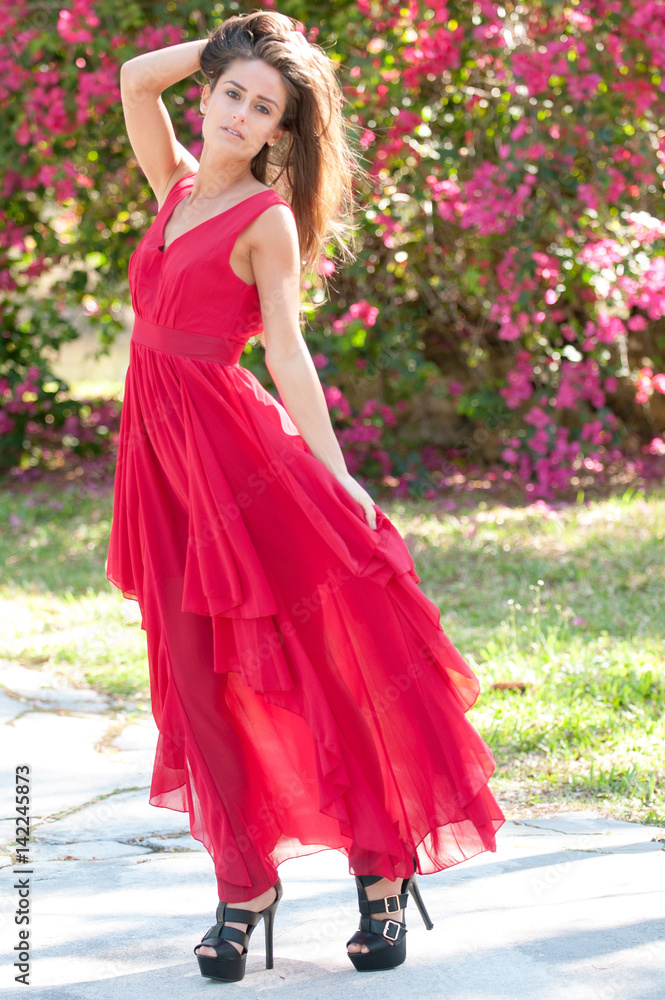 Woman in a red dress outside Woman in a red dress outside
