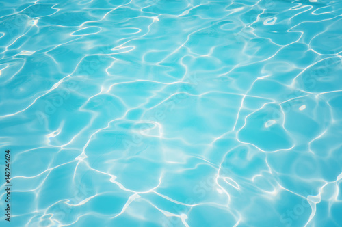 Blue water surface and ripple wave in pool