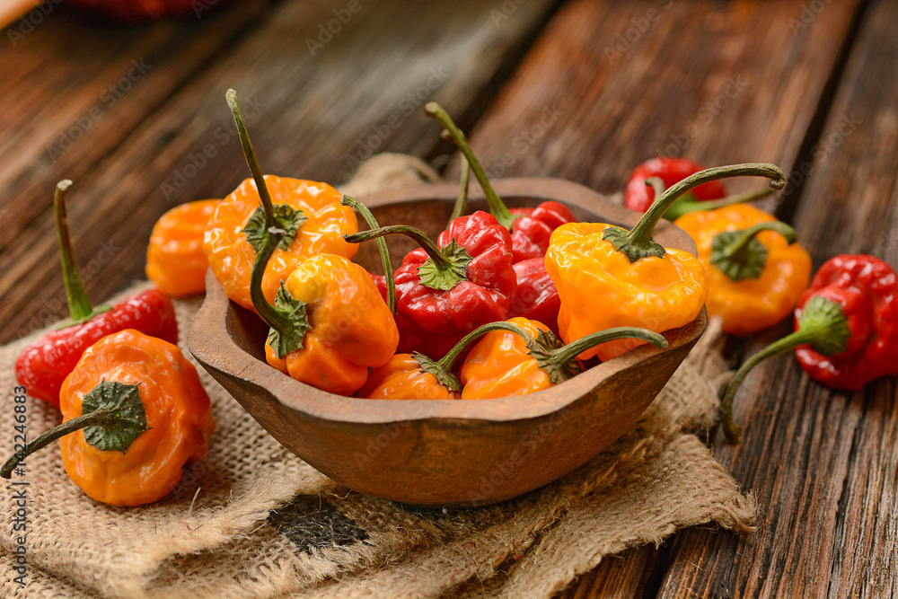 allspice red and yellow in the wooden bowl allspice red and yellow in the wooden bowl