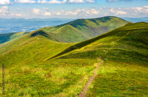 path through a meadow on mountain ridge