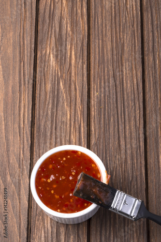 Bilde på lerret Barbecue sauce with basting brush