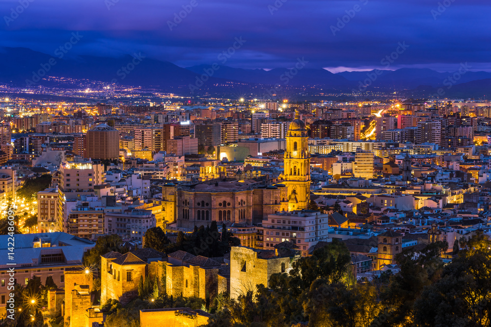 Malaga cathedral and cityscape at twilight