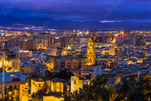 Malaga cathedral and cityscape at twilight