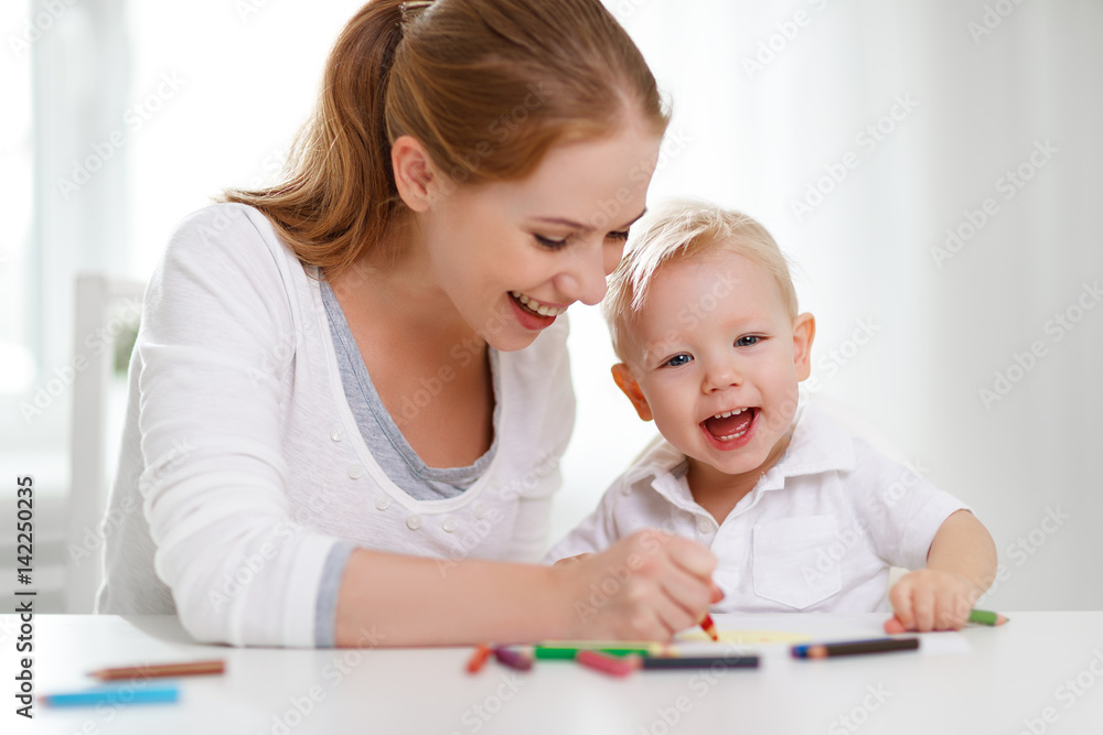 Mother with baby son with colored pencils Mother with baby son with colored pencils